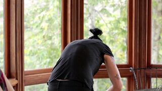 Vietnamese with a strap-on penetrates a virgin in the kitchen, showcasing passionate lesbian action