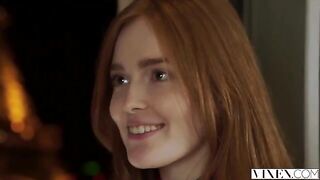 The guy carefully licked the cap of a red-haired woman