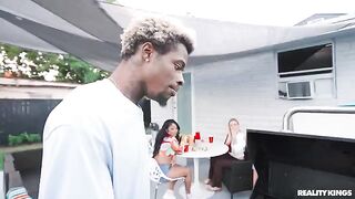 A black guy is fucking a girl at the BBQ in the spring