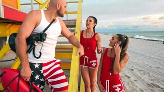 Two sexy lifeguards are having fun with a man in an FFM threesome