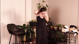 She bought a new cute dress and showed it on her body