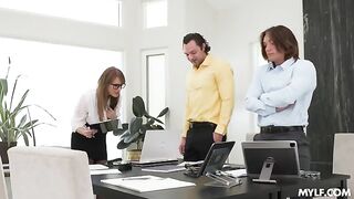 A woman has sex with two men at the same time with glasses