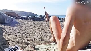 Two girls got caught by a stranger wanking on the nude beach