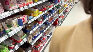 A sexy petite girl tried sitting on a bottle in the grocery store