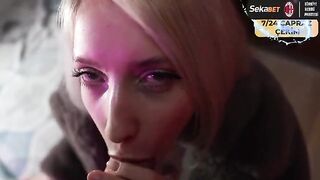 Saliva drips down her chin in sync with her movements, a steamy scene