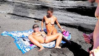 A girl undresses on the beach and plays with her body in front of a guy