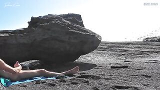 A girl undresses on the beach and plays with her body in front of a guy