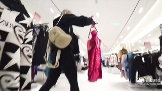 Babe almost gets caught while giving a blowjob in the fitting room, risking it all